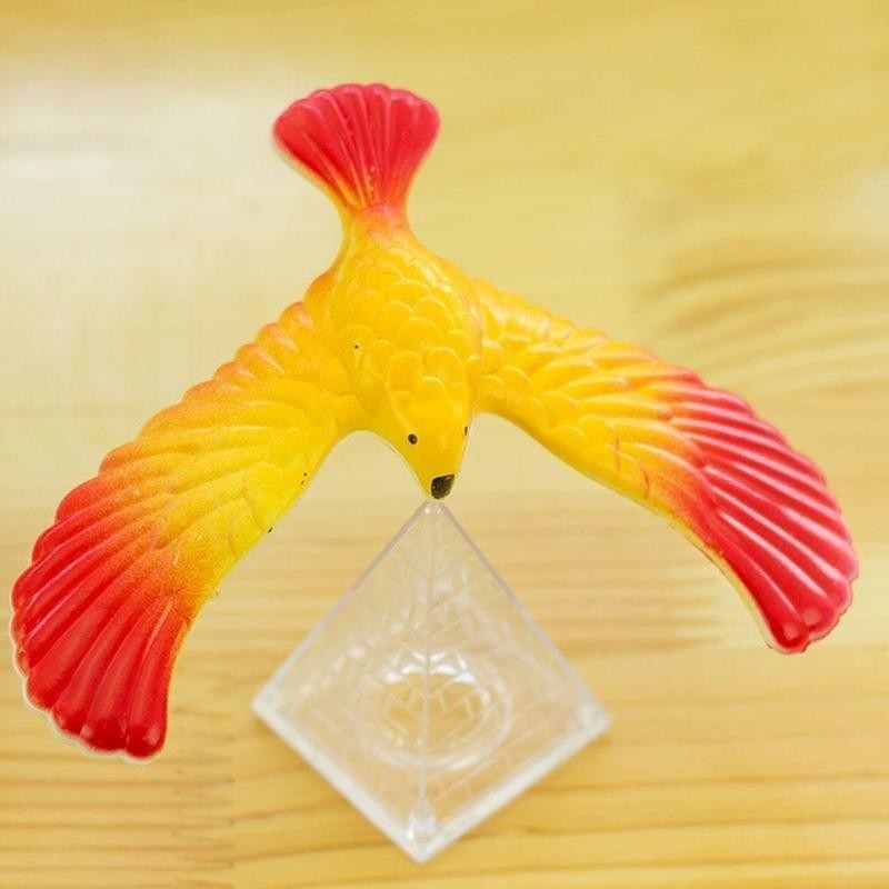 Yellow and Red balancing bird